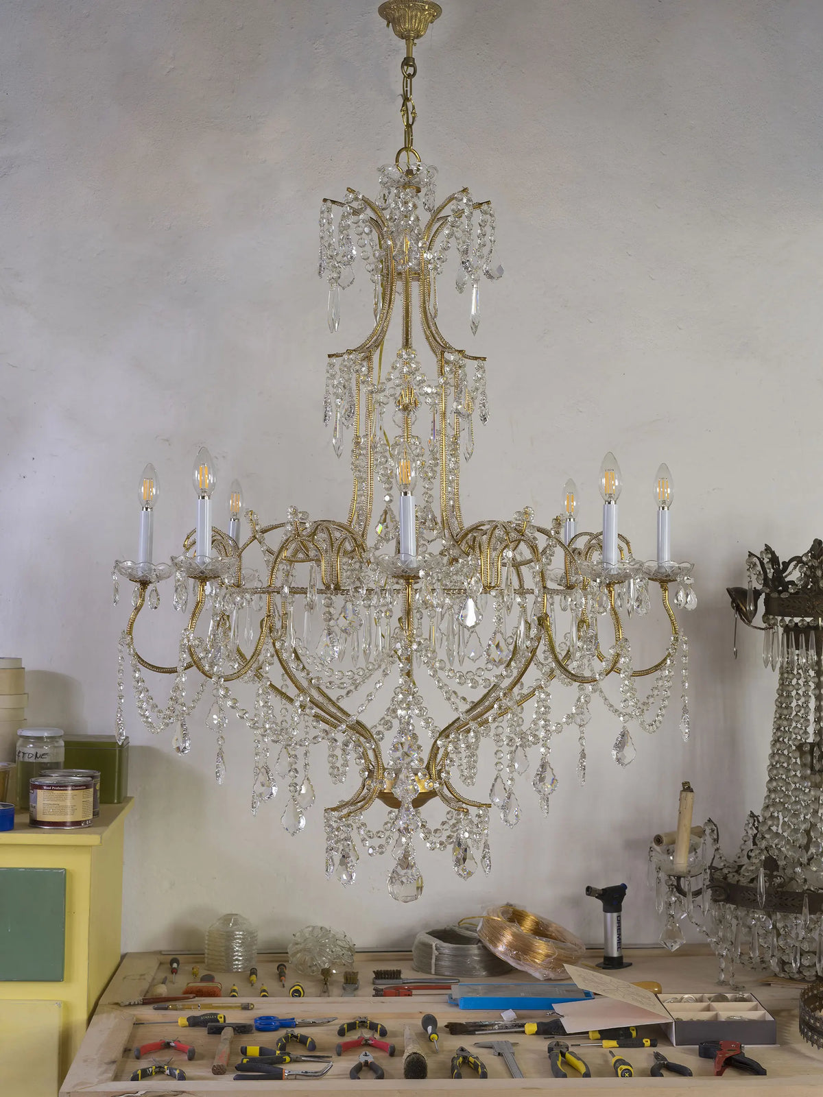Chandelier with a gold-tone metal frame covered in rows of glass and crystal spheres | Lo Stile Italiano
