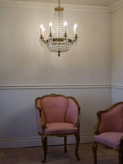 Antique chandelier photographed with two Napoleon III armchairs. | Lo Stile Italiano