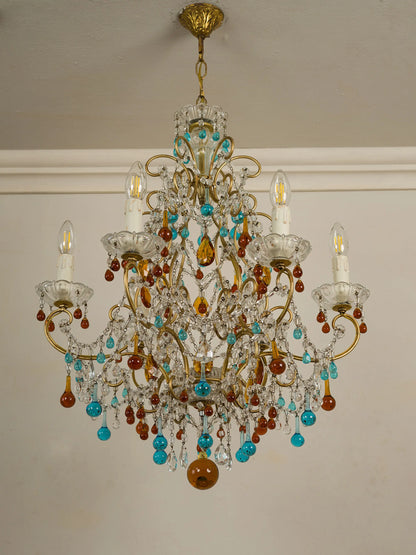 Lampadario italiano anni Sessanta con struttura in ferro battuto dorato e pendenti in vetro di Murano – Lo Stile Italiano